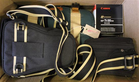 A Canon EOS 500N SLR, camera with EF 7S-300mm, EF 50mm and 28-80mm lenses